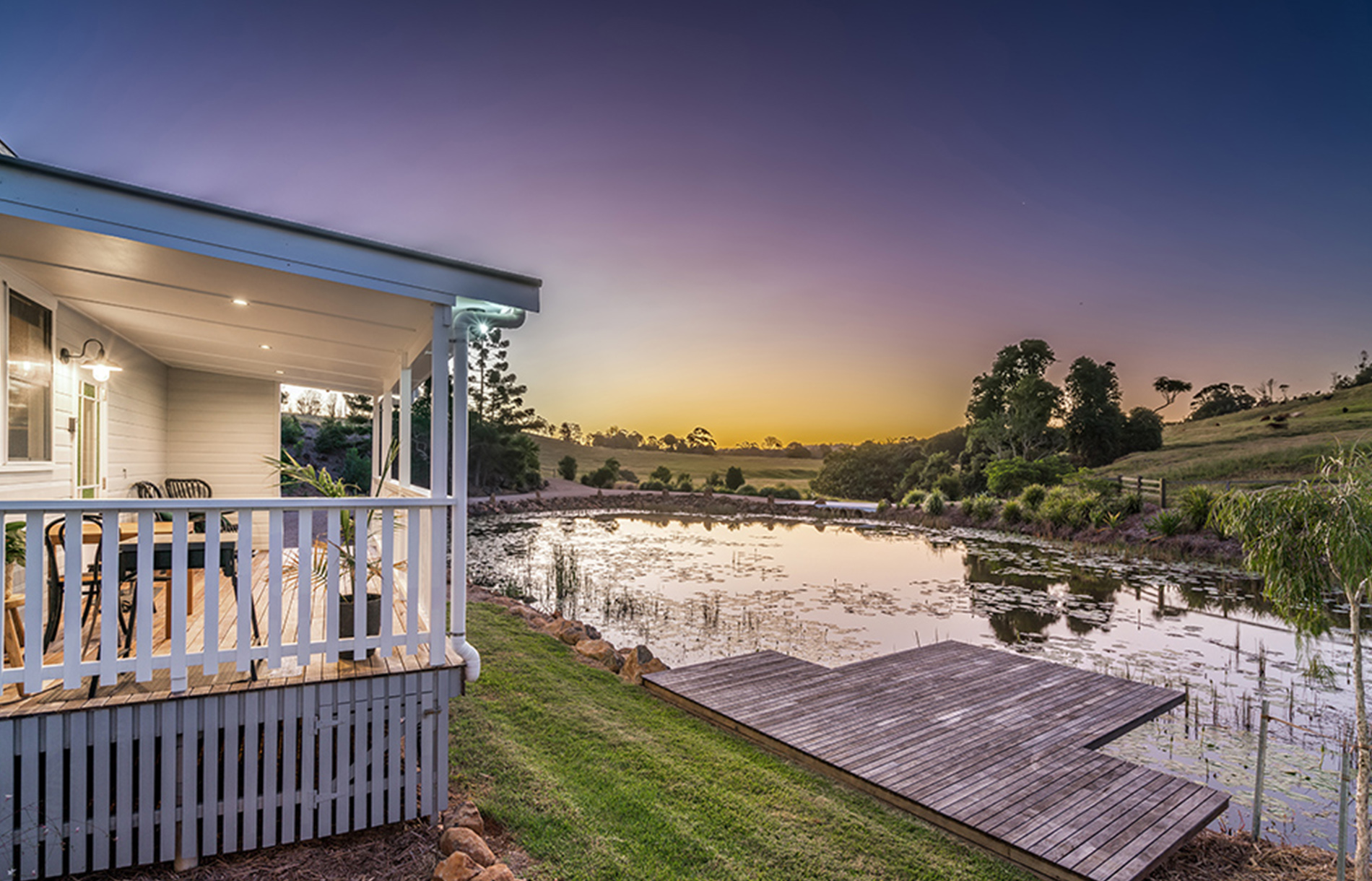 Sunset over the water with large deck for entertaining