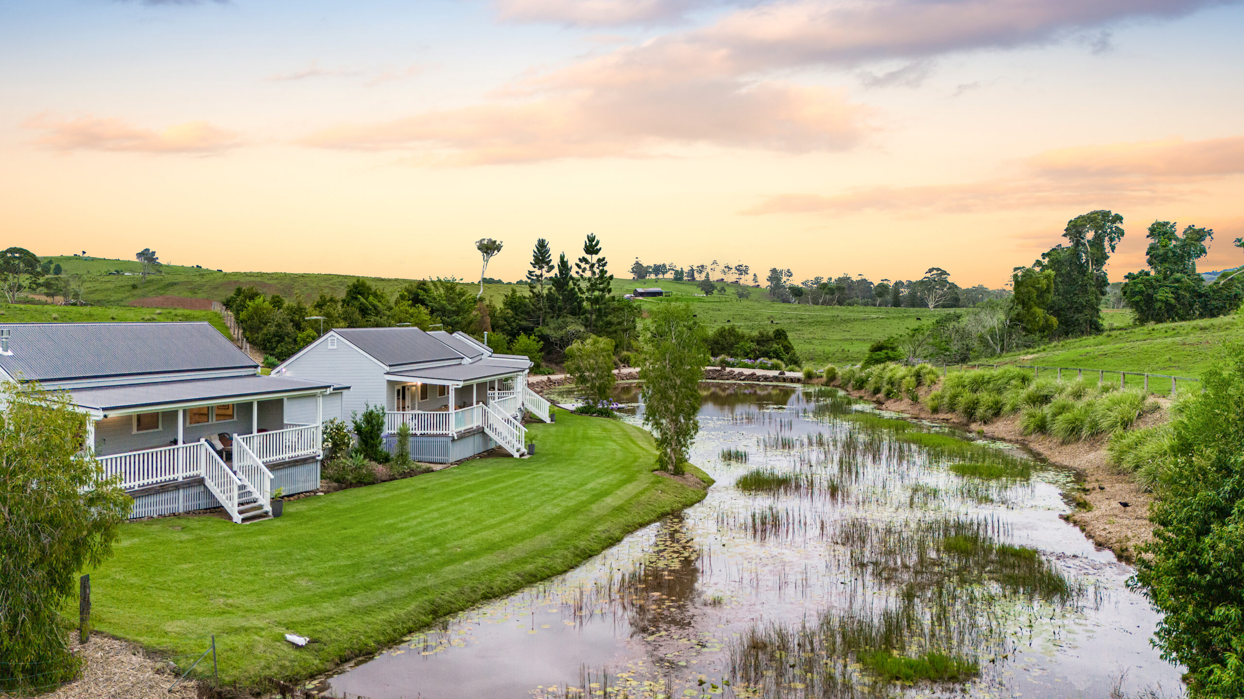 Quaint cottage surrounded by vibrant foliage and tranquil natural scenery at Forget Me Not Farm Cottages.